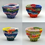 Tiny crocheted clay vessels by Jeremy Brooks