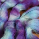 Breaking Wilton's violet food coloring on crocheted roving