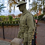 Life-size soldier at town memorial for Remembrance Day