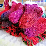 Mini knitted christmas stockings by Sue Wright