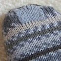 Repairing a hand-knit sock with a knit-in-place patch