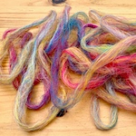 Variegated pencil roving from multicoloured blended top using a blending board