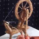 Animated tiny felted spinning wheel